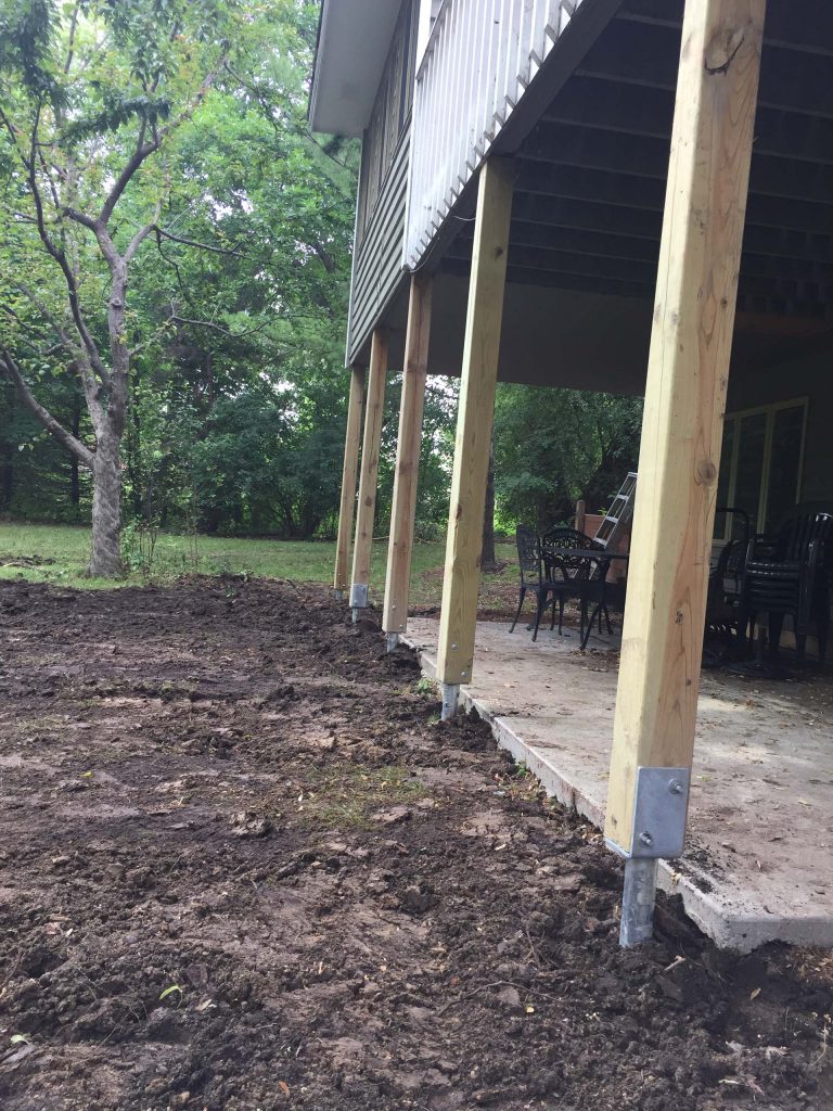 Deck and 4-season porch footings after helical pier installation